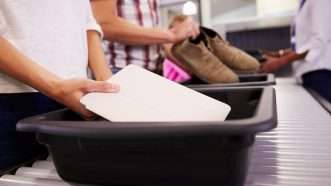 People placing items in bits for TSA inspection |  Monkey Business Images/Dreamstime.com C