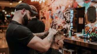 man cutting hair in a barber shop | Photo by <a href="https://unsplash.com/@hairspies?utm_source=unsplash&utm_medium=referral&utm_content=creditCopyText">Hair Spies</a> on <a href="https://unsplash.com/s/photos/barber?utm_source=unsplash&utm_medium=referral&utm_content=creditCopyText">Unsplash</a>   
