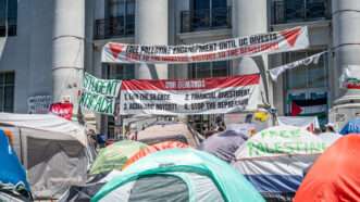 A campus encampment with pro Palestine signs and a list of demands. | Pat Mazzera / SOPA Images/Sipa USA/Newscom