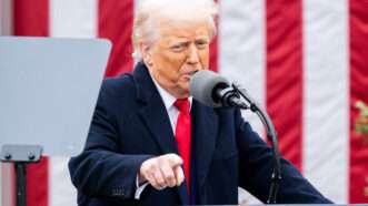 President Donald Trump points at someone from behind a lectern, in front of an American flag. | Michael Brochstein/Sipa USA/Newscom